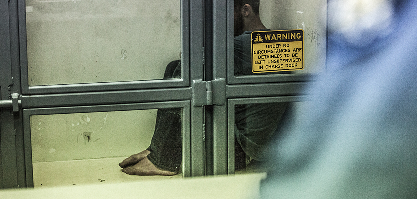 man in holding cell